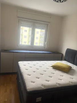 Bedroom with a double bed and a window. - image 3