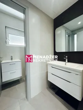 Modern bathroom with a washbasin and a mirror. - image 7