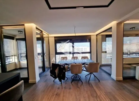 Living room with a dining area and large glass surfaces. - image 14