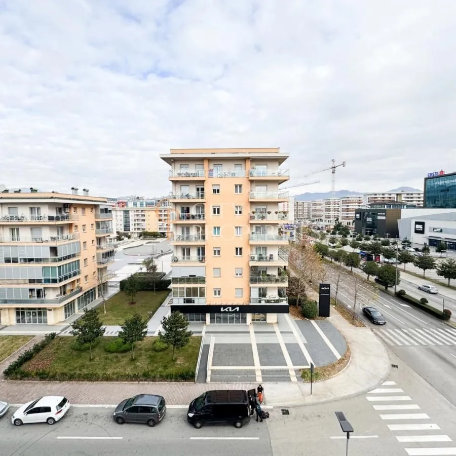 View from the window showing surrounding buildings, street, and cityscape.