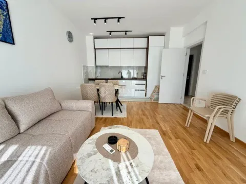 Living room connected to the dining area and kitchen. - image 4