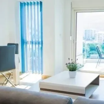 Living room with sofa, coffee table and access to the terrace. - image 2