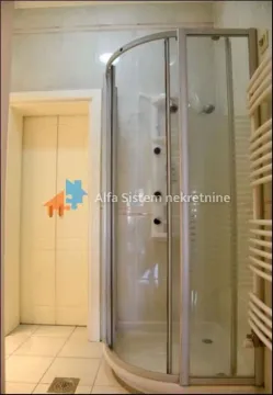Bathroom with a shower cabin and a door. - image 20