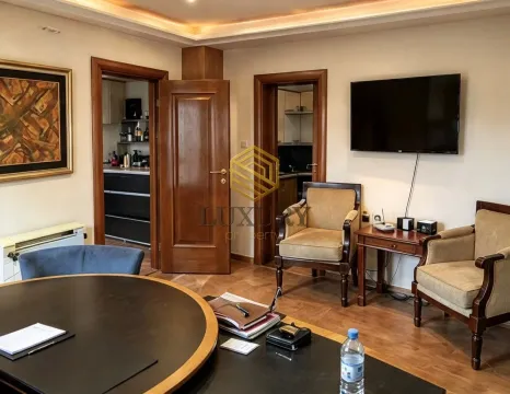 Living room with seating furniture, dining table, and a view of the interior doors. - image 4