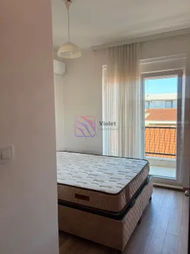 Bedroom with a bed and access to the terrace. - image 7