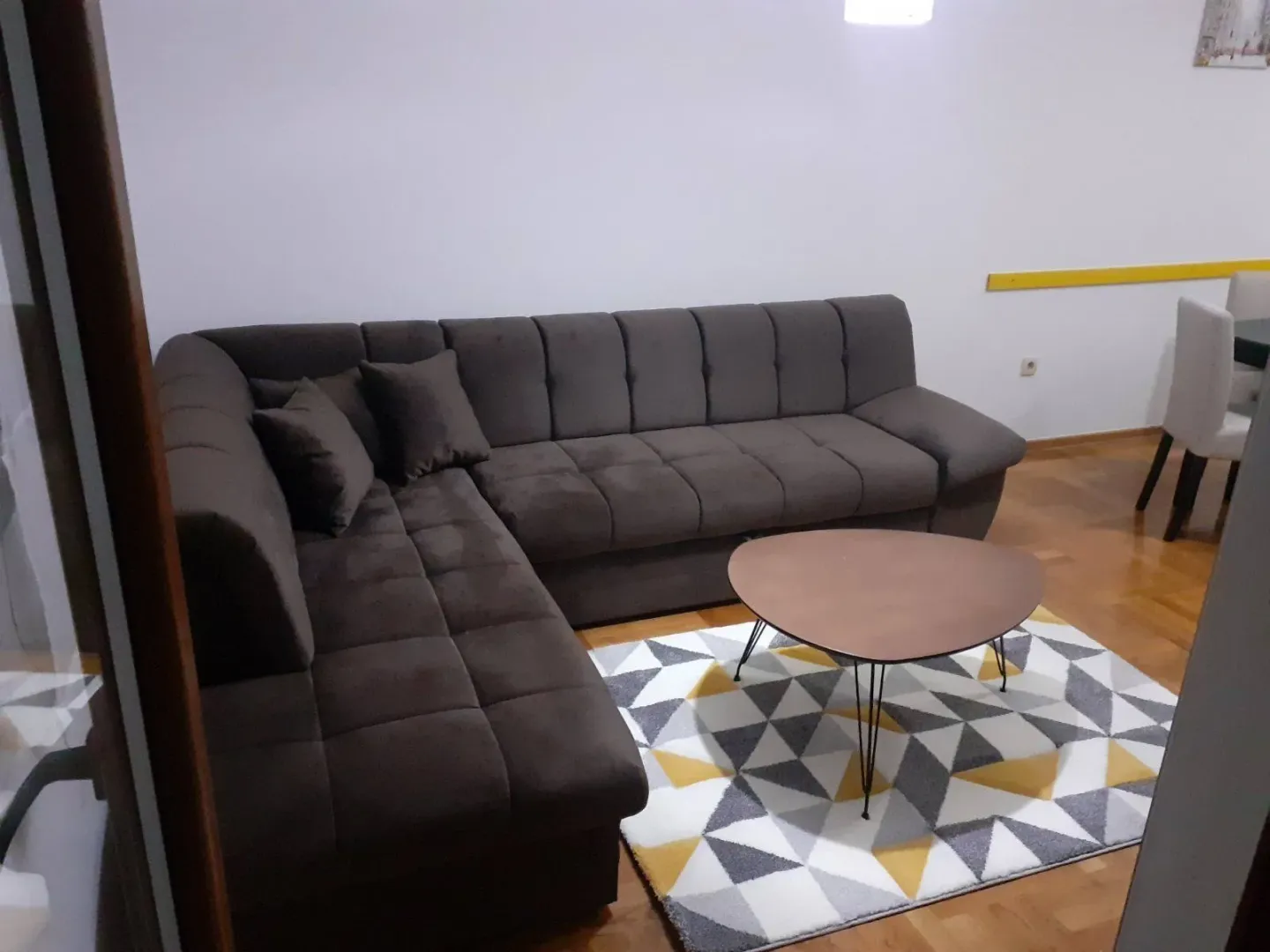 Living room with a brown corner sofa and a coffee table.