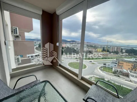 Glazed terrace with seating furniture and a view of the city and surroundings. - image 9
