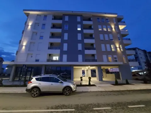 Exterior of a modern residential building at dusk. - image 7