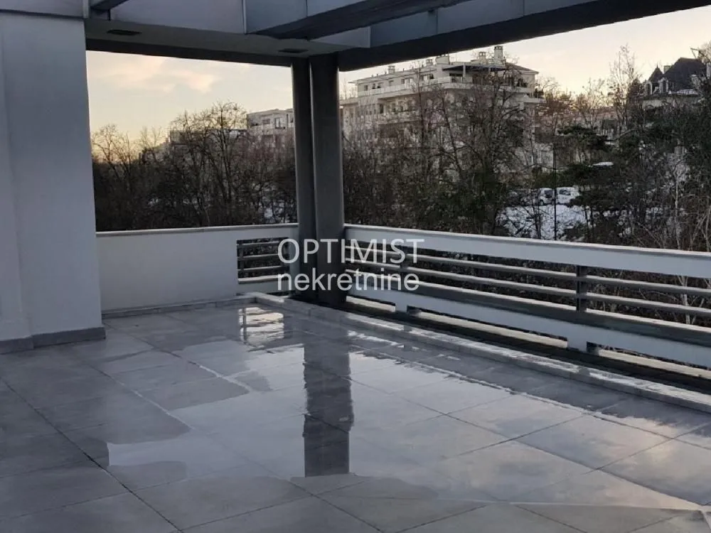 Spacious covered terrace with a view of the city.