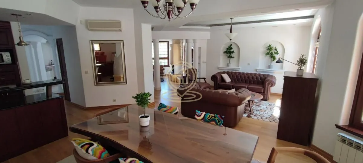 Spacious living room connected with the dining area and kitchen.