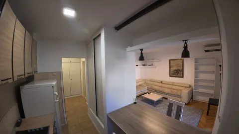 View of the living room and kitchen in the apartment. - image 9