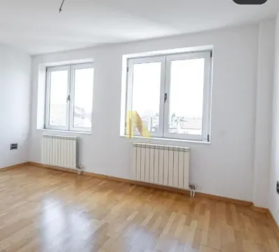 Empty room with parquet flooring and white walls. - image 15