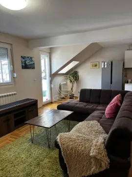 Living room with a sofa, coffee table and TV unit. - image 5