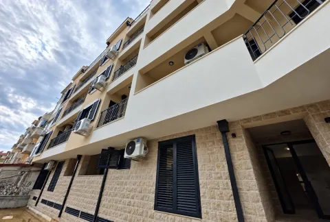 View of the exterior of an apartment building with balconies and air conditioning units on the facade. - image 18