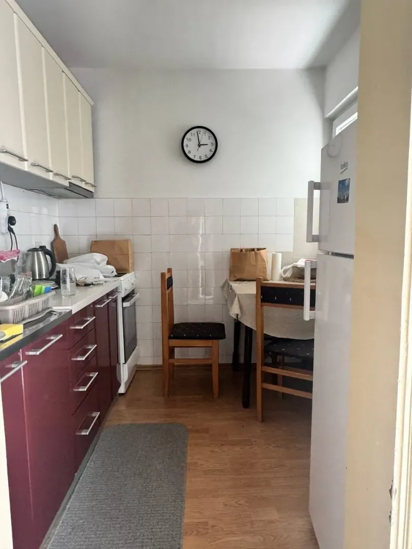 Smaller kitchen with a dining table and chairs.