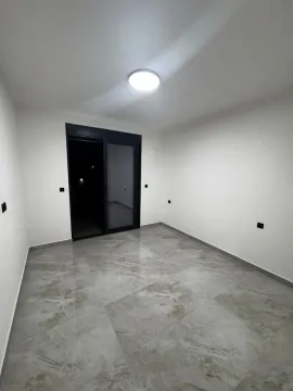 Empty room with ceramic floor tiles and access to the terrace. - image 10