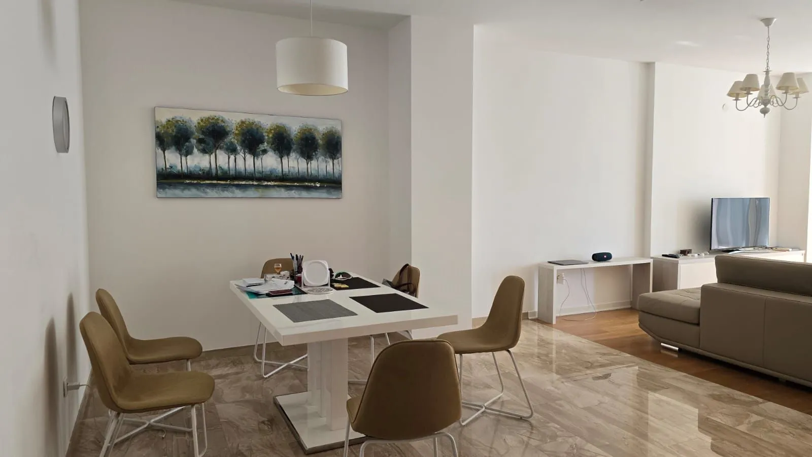 Living room with a dining table and chairs.