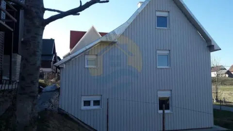 Exterior view of the house with panel-clad facade. - image 10