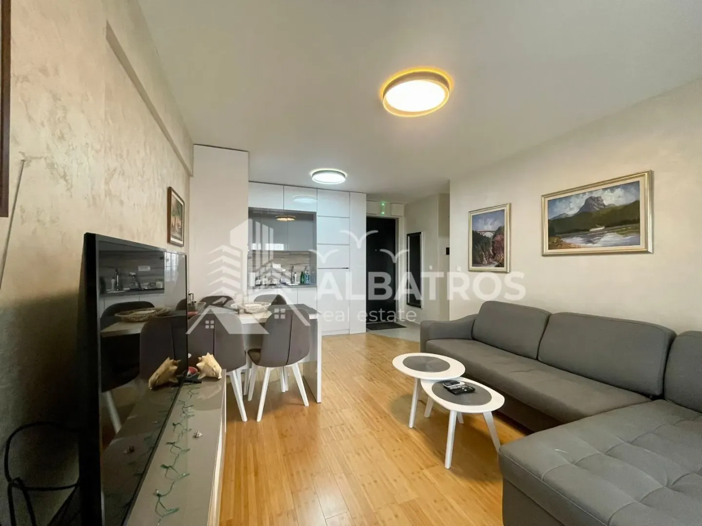 Spacious living room connected with the dining area and kitchen.