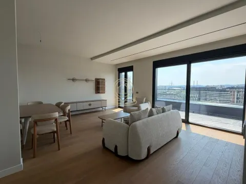 Spacious living room with a dining area and large glass surfaces. - image 7