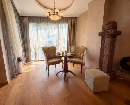 Living room with seating furniture and a large window. - image 3