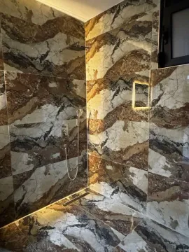 Modern ceramic tiles in the shower enclosure with a built-in faucet. - image 12
