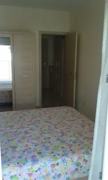 Bright bedroom with a wardrobe and an open door to the hallway. - image 5