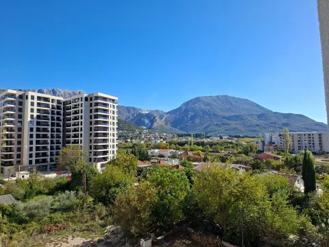 View from the terrace overlooking the neighborhood, surrounding greenery, and mountains. - image 3