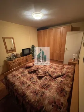 Furnished bedroom with a double bed, wardrobe, and chest of drawers. - image 5
