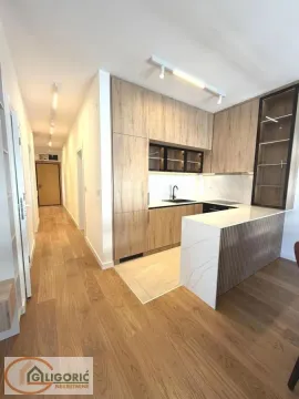 Modern kitchen with wooden elements and built-in appliances. - image 8