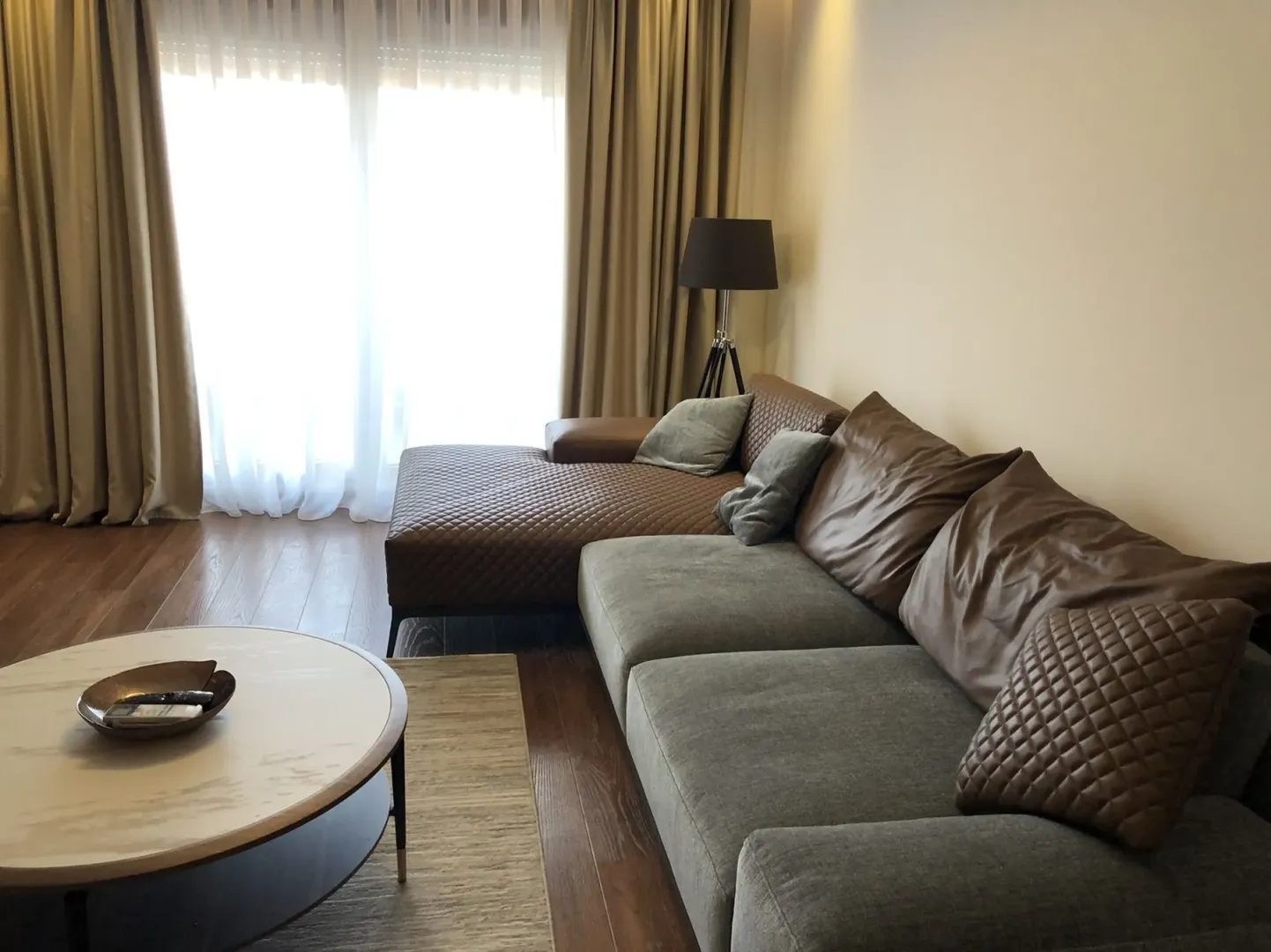 Bright living room with a modern corner sofa.
