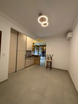 Living room with a kitchen in light tones. - image 4