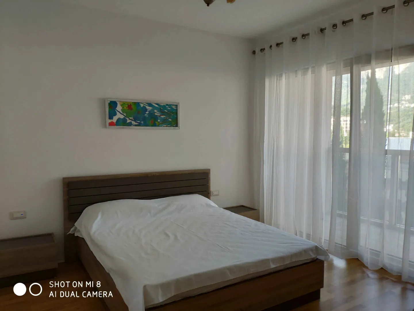 Bright bedroom with a double bed.