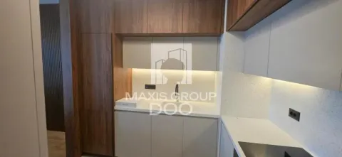 Modern kitchen with wooden elements and recessed lighting. - image 7