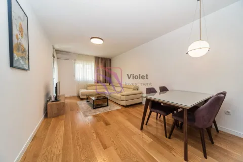 Living room with a sofa set and a dining table. - image 2