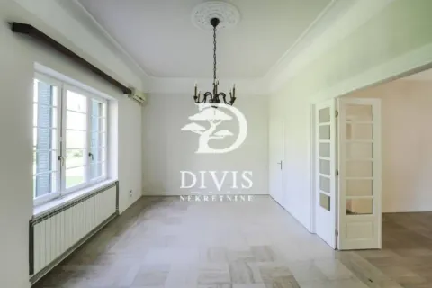 Empty bright room with windows and white double doors. - image 3
