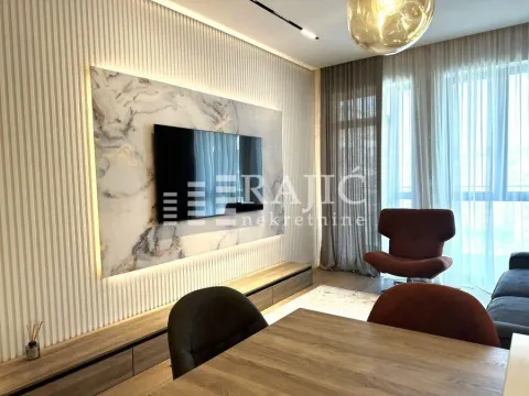 Modern living room with a TV unit and dining table. - image 4