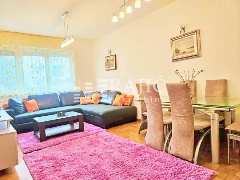 Living room with a sofa set and a dining table. - image 2