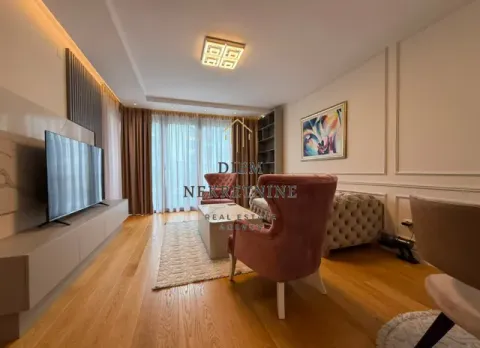 Modern and bright living room with seating area and TV. - image 7