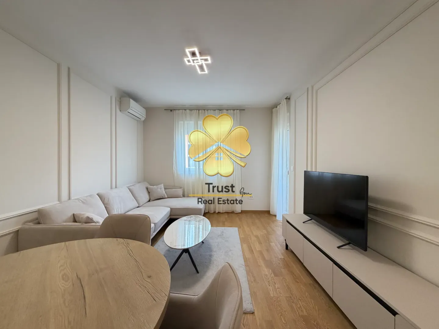Spacious living room with a sofa set and dining table.