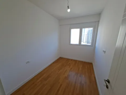Empty room with white walls and wooden flooring. - image 14