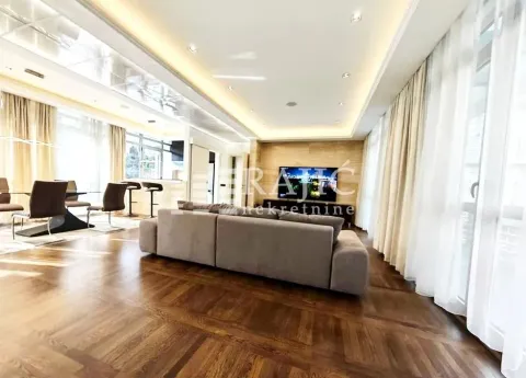 Spacious and bright living room with a sofa set and dining area. - image 2
