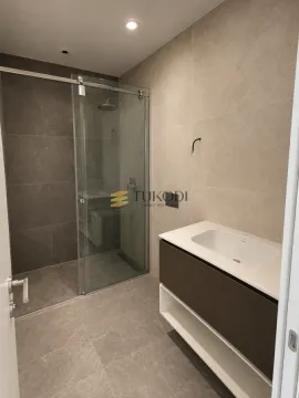 Modern bathroom with a walk-in shower and vanity unit. - image 8