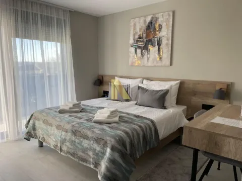 Decorated bedroom with a double bed and light furniture. - image 6