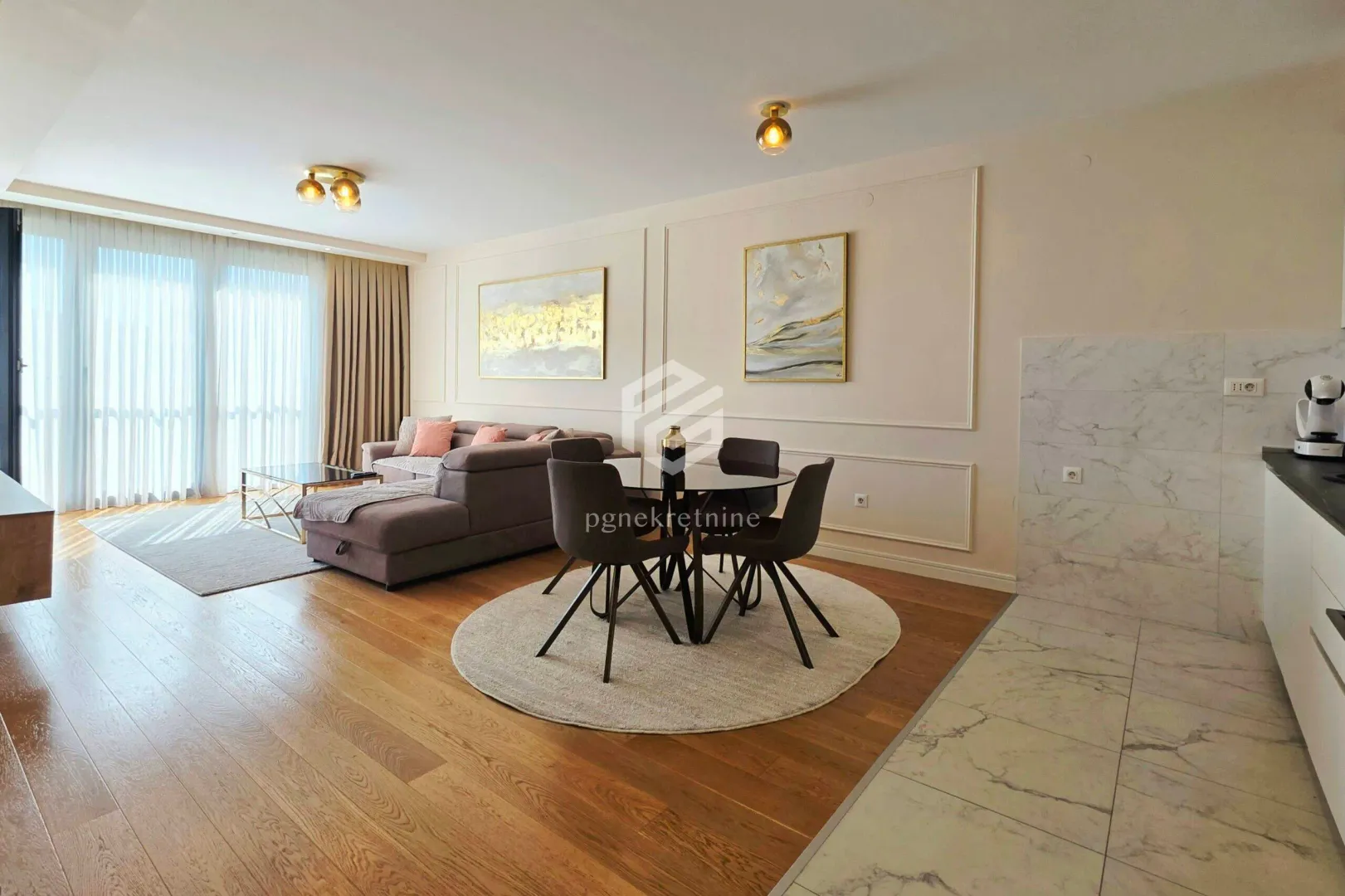 Living room with a dining area and a seating set.
