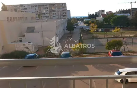 View from the terrace overlooking surrounding buildings and the street. - image 8
