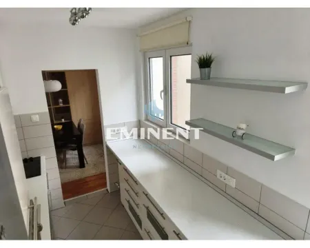 Small bright kitchen with white cabinets and wall shelves. - image 9