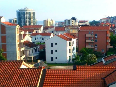 View of surrounding residential buildings and rooftops from above. - image 3