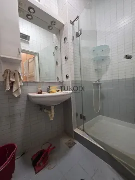 Bathroom with a washbasin, mirror and a glass shower cabin. - image 2