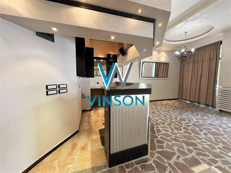 Kitchen with a bar counter connected to the dining area.